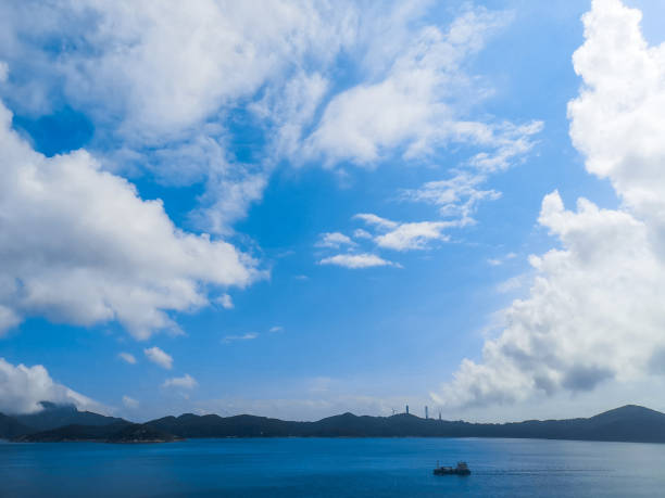 istock Blue sky and white cloud, sunny day on Lamma Island 1253038431