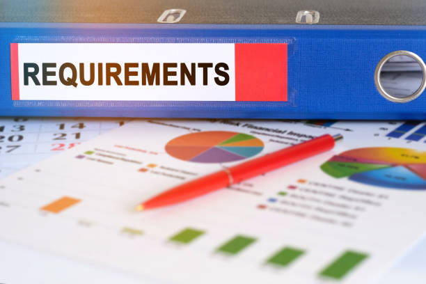 istock On the table are pie charts, a pen and a folder with the inscription - REQUIREMENTS. 1253040008
