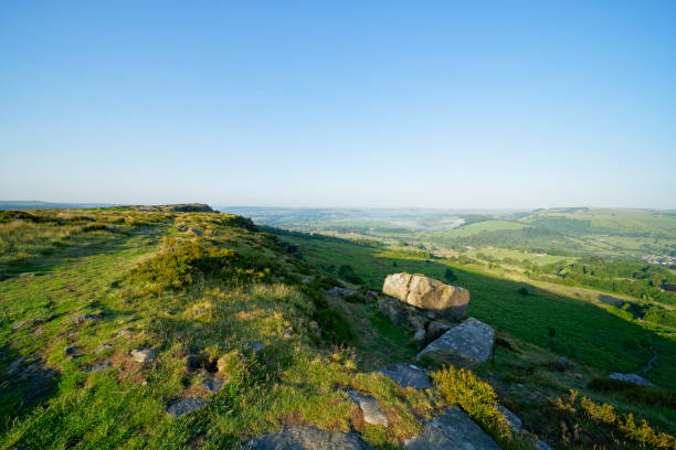 istock Bright, hazy summer morning on Baslow Edge 1253040474