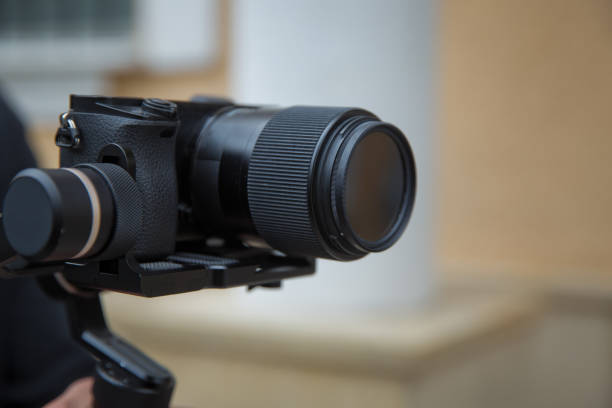 istock Focus on tripod mounted camera screen showing . Digital equipment recording video . Close up successful man recording video, using digital . Blogger recording vlog video on camera with at the birthday. 1253041102