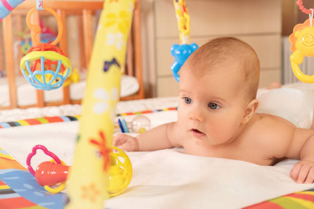 istock A small child crawls on a mat 1253042894