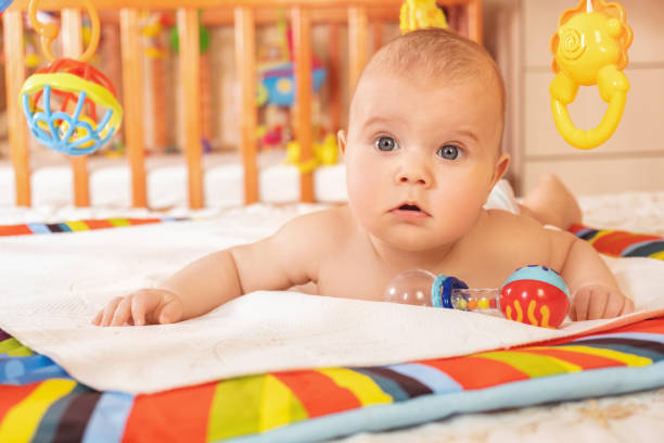 istock A small child crawls on a mat 1253042900