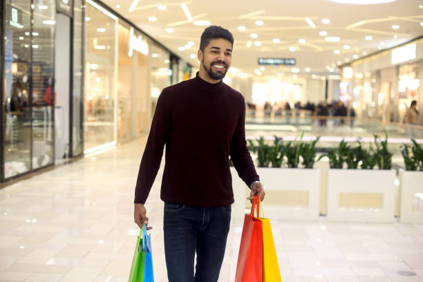 istock Man in a shopping mall 1253046407