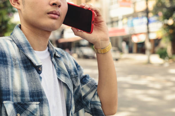 istock Asian man waiting for taxi 1253046787