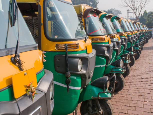 istock Yellow and green auto rickshaws in Indiya 1253046849