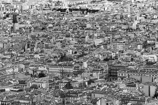 Black and white aerial view of Marseille historic center seen from Notre Dame de la Garde viewpoint. Marseille, France, January 2020