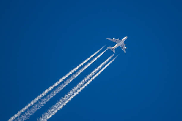 istock A plane is flying over the blue sky 1253049247