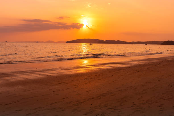 istock Sunset on beach in krabi island, thailand. 1253051041