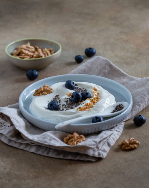 istock Natural yogurt with blueberries and walnuts 1253051482