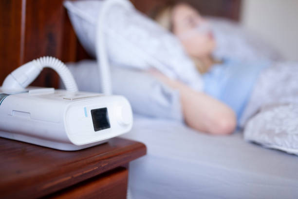 Cpap machine, Woman wearing oxygen mask with copy space cpap machine sleep apnea photos stock pictures, royalty-free photos & images