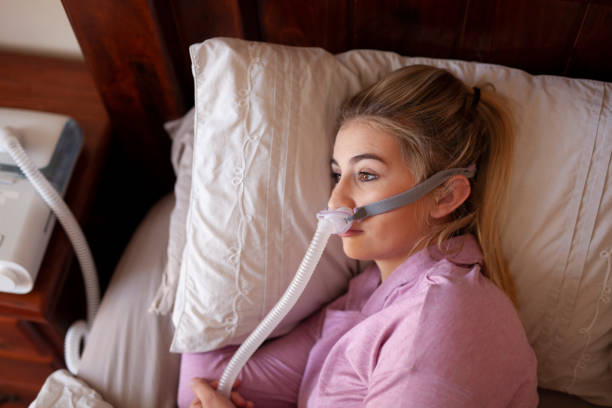 istock Can't sleep with cpap machine, frustration 1253052617
