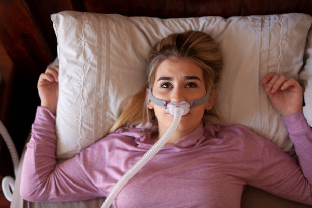 istock Awake with cpap mask on face sleep disorder 1253052619