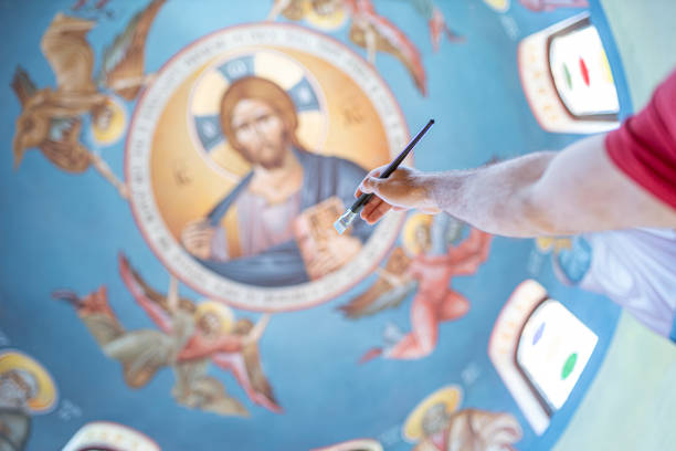 istock Reaching church ceiling with a paintbrush 1253053839