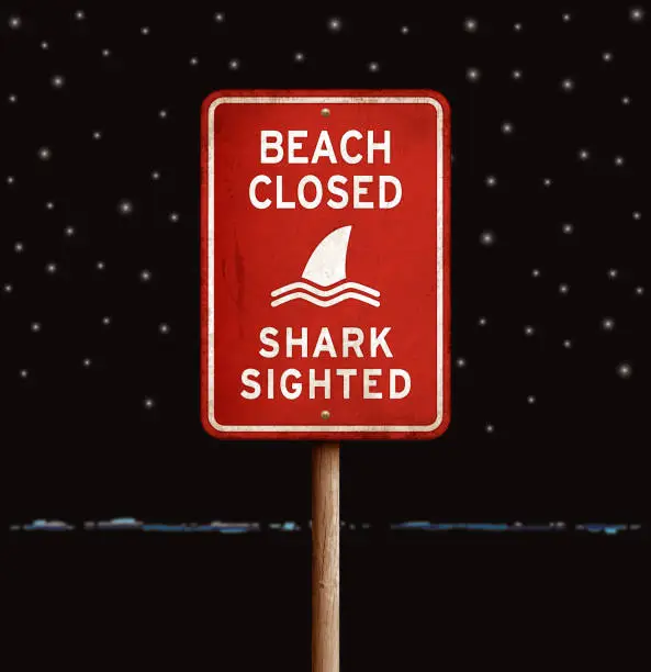 Vector illustration of Rusty red 'beach closed_shark' warning sign with starry night