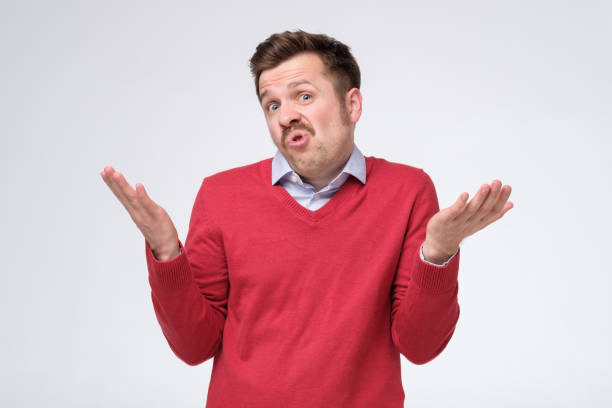 istock Confused caucasian man is unsure having no idea what to do next 1253055217