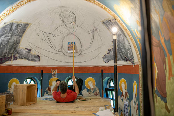 istock Painting frescoes on a church ceiling 1253055231
