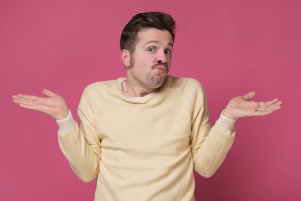 istock Confused caucasian man is unsure having no idea what to do next 1253055245