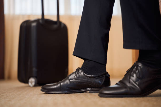 istock Man on business trip in hotel room 1253056750