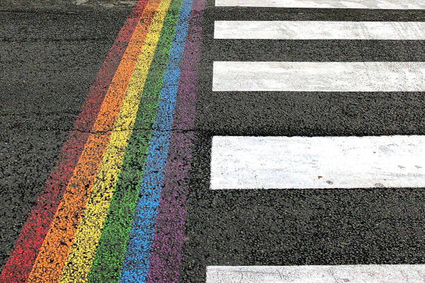 istock pedestrian crosswalk with additional vertical LGBT color rainbow stripe 1253057864