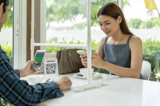 istock Asian customer scanning QR code for online menu un new normal restaurant 1253060164