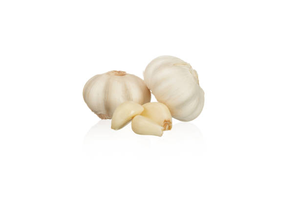 Close-up of garlic clove on white background