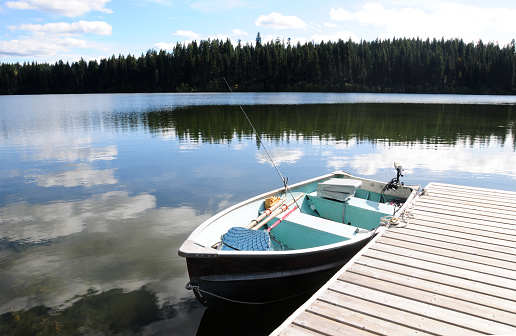 Dock and boats on the water of Fawn lake