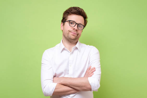 istock man looking in contempt, feeling loathing and disgust towards something 1253061664