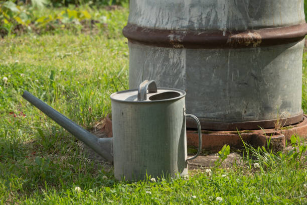 istock Rain barrel in a rain storm in garden 1253063129