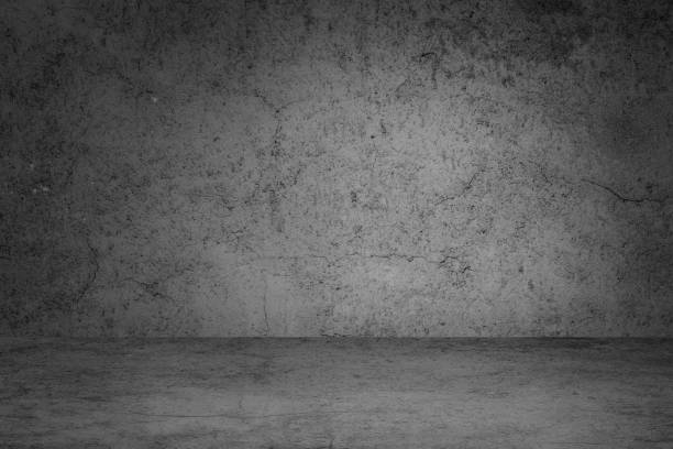 istock Studio dark room black concrete grunge wall with concrete floor. 1253067631