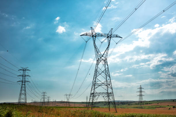 istock Electric Power Lines and Transmission Tower 1253069142