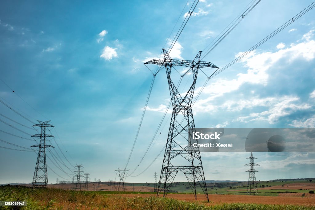 Electric Power Lines and Transmission Tower Electricity Pylon Stock Photo