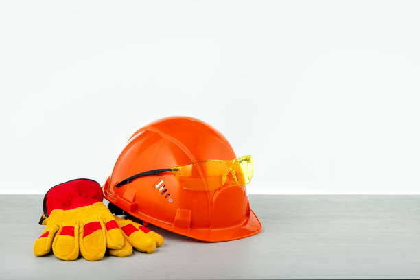 istock For safety at work. Construction safety equipment: helmet, protective gloves, glasses. 1253069145