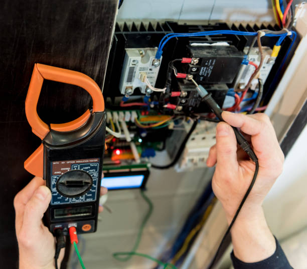 istock The man is repairing the switchboard voltage with automatic switches. 1253070431