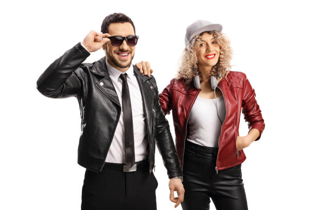istock Young man with sunglasses with a young woman both wearing leather jackets 1253070667