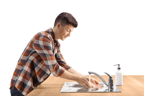 istock Profile shot of a guy washing hands 1253070669