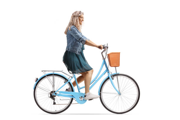 istock Young woman riding a blue city bicycle 1253070677