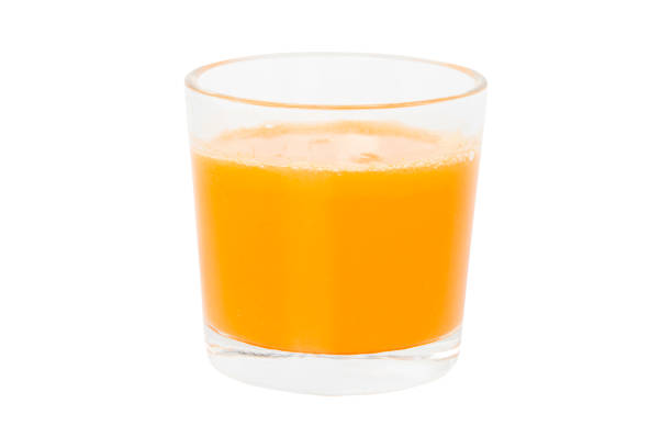 istock 100% Orange juice glass isolate on white background. 1253071504