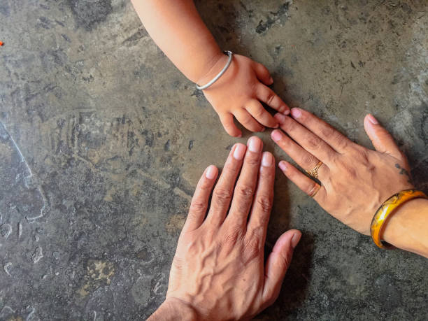 istock Hand of mother father and son 1253071676
