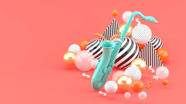 istock Blue saxophone surrounded by golden balls on a pink background.-3d render. 1253073335