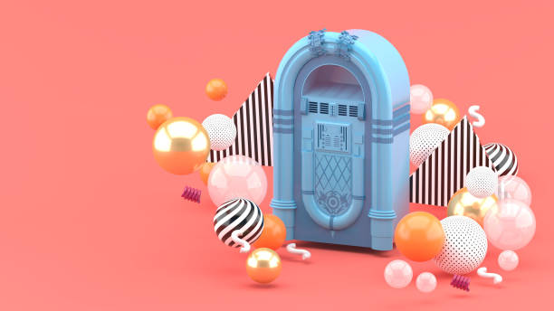 Blue jukebox among colorful balls on a pink background.-3d render."n Blue jukebox among colorful balls on a pink background.-3d render."n digital jukebox stock pictures, royalty-free photos & images