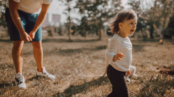 istock Father and daughter enjoy the park 1253076234