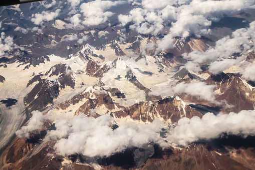 Beautiful sandstone Himalayan mountains with snow. View from the airplane of Leh - Ladakh, Northern India.