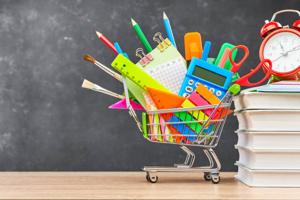 istock School supplies on a blackboard background 1253078753