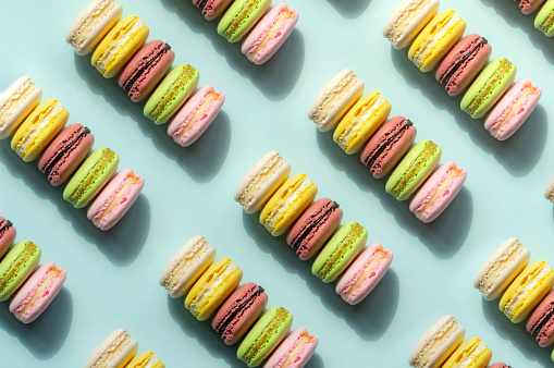 Colorful macaroons on blue background