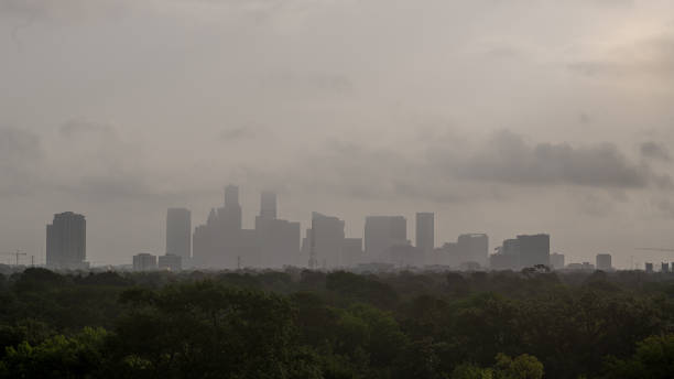 Sahara Dust Cloud Over Houston Houston morning downtown skyline obscured by Sahara dust cloud dust storm stock pictures, royalty-free photos & images