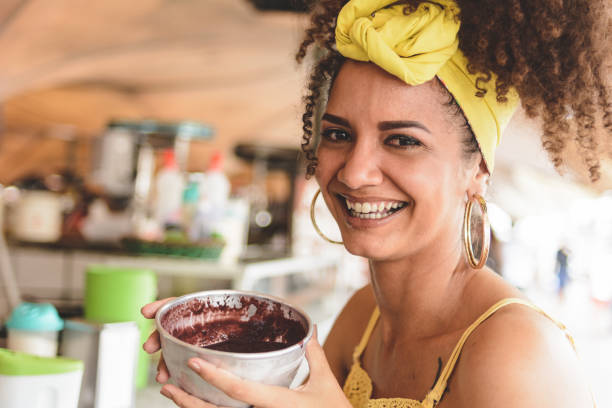 Woman holding a bowl with acai at in Belem do Para