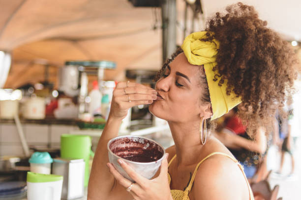 Woman holding a bowl with acai at Belem do Para Woman holding a bowl with acai at Belem do Para belém brazil stock pictures, royalty-free photos & images