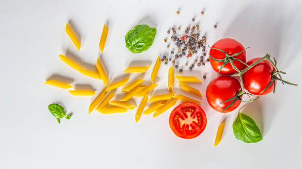 istock Penne pasta with tomatoes, basil and peppercord 1253081049