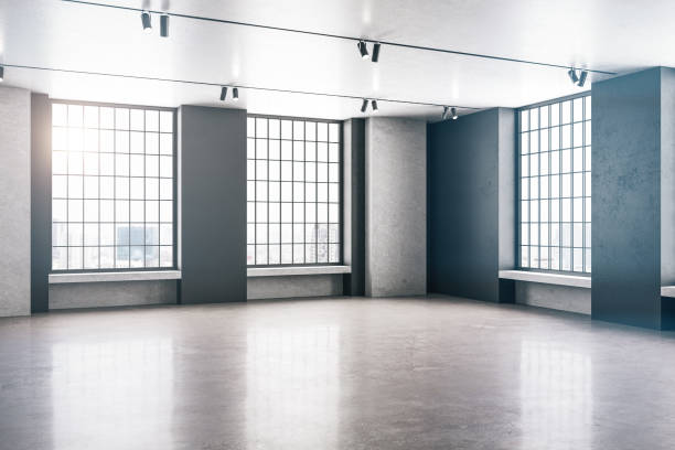 istock Contemporary loft gallery interior with windows to city 1253081490