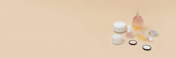 istock Banner with women's cosmetics on beige background. 1253082687